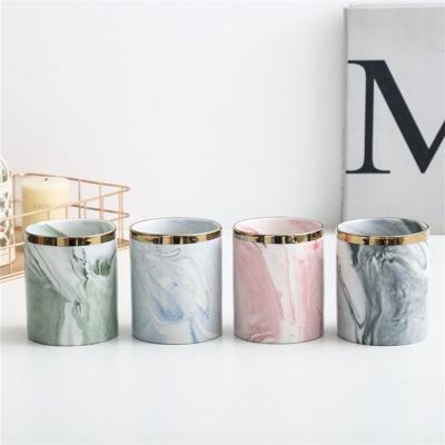 China Wholesale Nordic Modern Luxury Home Decoration Cylinder Free Sample Cylinder Empty Marble Ceramic Candle Jar Modern Wedding With Gold Rim for sale