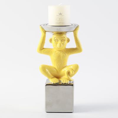 China Stylish Home Decor Small Animal Shape Mokery Base Yellow Modern Cheap Candle Holder For Home Decor for sale