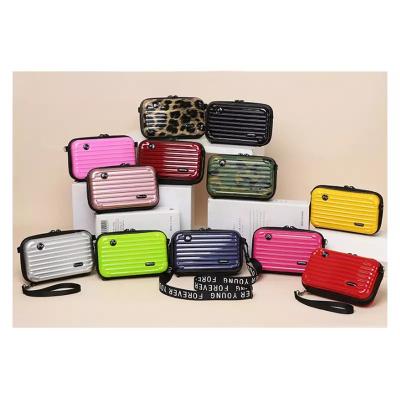 China Hot Selling Fashion FANLOSN Shape Travel Suitcase Hard Makeup Case Cosmetic Bags Box Purse Women Bags for sale