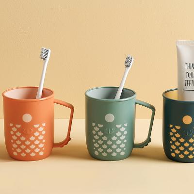 China Viable Wholesale Home Fashion Travel Mug With Custom Reusable Plastic Handle Wash And Gargle Toothbrush Cups for sale