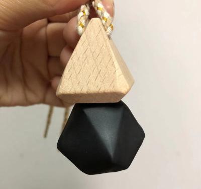 China Cheap Ready to Ship Matte Black Car Hanging Perfume Bottle in Diamond Shape, 8ml Empty Diffuser Bottle with Wooden Triangle Cap for sale