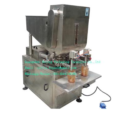 China Food Small Scale Manual Two Nozzle Pepper Sauce Filling Machine for sale