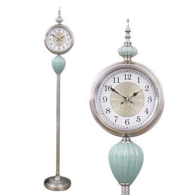 China Antique Style 12 inch luxury home living room creative decoration metal vertical clock fashionable ceramic Christmas gift silent floor clock for sale