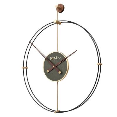 China Minimalist 24 inch concept home living room decoration modern Spanish style clock art fashion brass luxury silent wall clock for sale