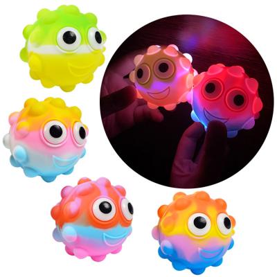 China Squeeze Toy Direct Marketing 3D Silicone Cartoon Squeeze Led Automatic Eyes and Moving Balls Lighted Toys for sale