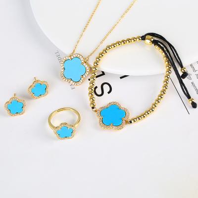 China Fashionable New Design 4pc Cute Flowers 18K Gold Stainless Steel Chain Necklace Ring Bracelet Set Women Luxury Earrings for sale