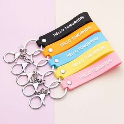 China Factory PVC Plastic Wristband With Key Ring Rubber Band Key Chain Key Chain for sale