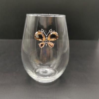 China Viable Novelty Fascinating Stemless 20oz Wine Glasses with Amber Butterfly for Christmas for sale