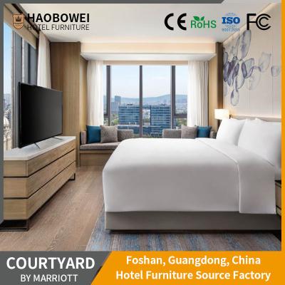 China Curved Backrest Foshan 4 Star King Size Bedroom Set Marriott Resort Hotel Furniture zu verkaufen