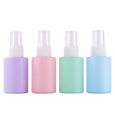 China Cosmetic Flat Shoulder Macaron Spray 1oz Pink Purple Cosmetic Glass Bottle With Sprayer for sale