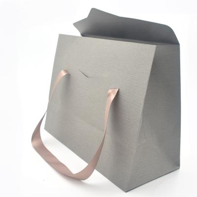 China Recyclable Gift Logo Shopping Luxury Clothes Custom Wine Wedding Kraft Paper Bag for sale