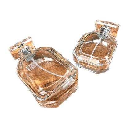 China 50ml 100ml New Exquisite Makeup Oil Women Cosmetic Package Sub Transparent Glass Bottle With Cover Empty Bottle for sale