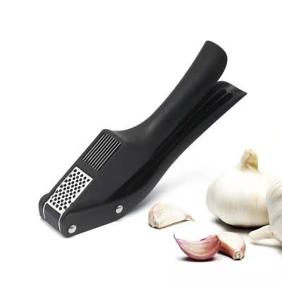 China Sustainable High Quality Multifunctional Garlic Curved Plastic Garlic Press for sale