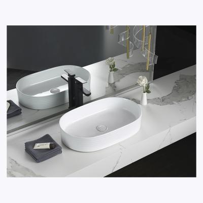 China Modern Wholesale Ceramic Oval Vessels Drop Over White Bathroom Vanitys Sink Counter Sink Art Basin for sale