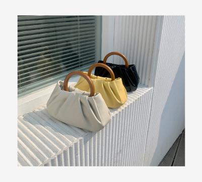 China 2021 New Fashion Niche Designer Handle Ladies Handbag Wooden Fold Cloud Bag Women's Mini Bag for sale