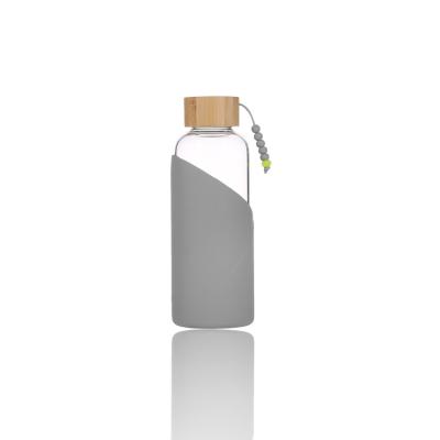 China Viable Wholesale Cheap Juice Silicone Sleeve Bottle Glass Price Water Bottle for sale