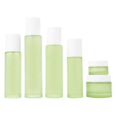 China Green color serum eye cream jar cosmetic frosted luxury glass/spray bottle set glass cosmetic packaging jar for sale