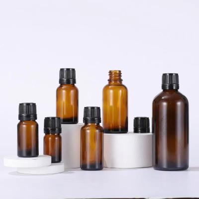 China Personal Care 5ml 10ml 15ml 20ml Amber Color Essential Oil Glass Bottle With Black Pile Proof Screw Cap for sale