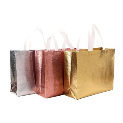 China Eco - Friendly Metallic Laminated PP Gold Packaging Non Woven Gift Bags For Christmas for sale