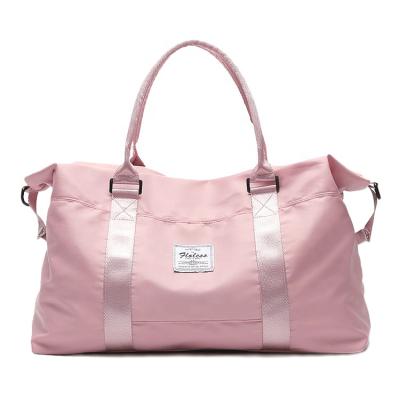 China Fashion Customized Logo Large Capacity Pink Duffle Bags Gym Women Waterproof Sports Travel Bag for sale