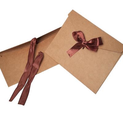 China Recyclable Custom Logo Foil Different Color Ribbon Bow Closure Paper Envelope Packaging Box for sale