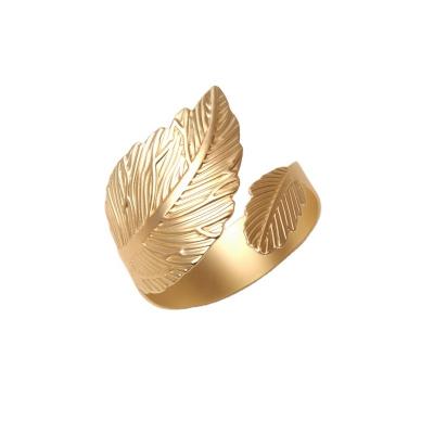 China Viable Wholesale Gold Feather Biloba Napkin Ring Wedding Elegant Christmas Dining Table Decor Silver Metal Cut Napkin for sale