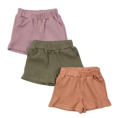 China Summer Breathable Fashionable Kids Clothes 3 Colors 100% Cotton Waffle Shorts With Pockets Daily Wear Comfortable Warm Girls Underpants 0-16 Years Old for sale