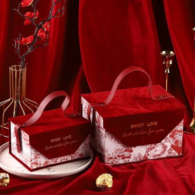 China Recycled Materials Wholesale Tote Boxes Red Candy Chocolate Box With Small Handle Gift Box For Wedding Favor for sale