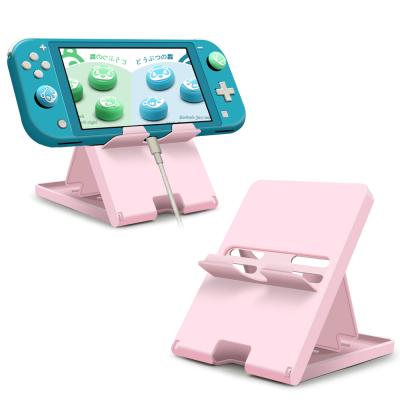 China Foldable For Switch PlayStand, New Arrival Candy Color Game Console Stand Nintendo Base For Nintendo Switch Lite for sale