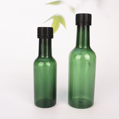 China BEAUTY PACKAGING 60ml 100ml Mini PET Plastic Bottle For Wine Juice With Plastic Cap for sale