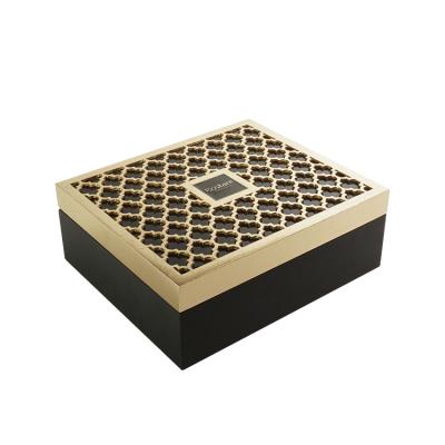 China Professional /Eco-Friendly Cardboard Box Manufacturer Custom Logo Handmade Glossy Black Tea Recyclable Paper Box With Carving Metal Flower for sale