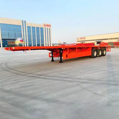 China 3 Axles Semi Truck Trailer EHL9400TPB Max Payload 28 Ton Steel Low Bed Semi Trailer for sale