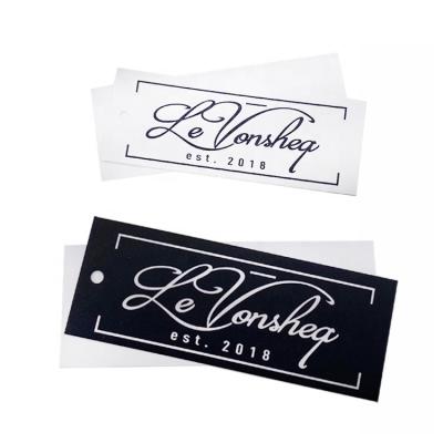 China Recyled Garment Accessories Paper Label Embossed Logo White Black Cardboard Hangtag For Apparel for sale