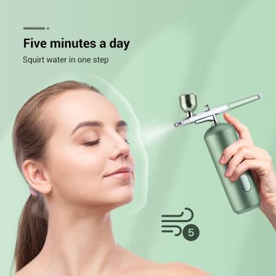 China New 13*4cm Diameter Jet Oxygen Injection Instrument Household High Pressure Portable Handheld Nano Water Beautiful Lightweight Facial Moisturizer for sale