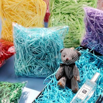 China 100g/Bag waterproof gift baskets stuffing filler for shinny iridescent shredded paper in various glitter colors for sale