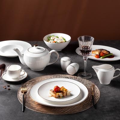 China Yantai tongli sustainable hotel restaurant gold rim embossed western style white ceramic dishes set porcelain dinnerware set for sale