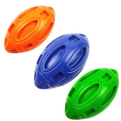 China Durable Natural Rubber Dog Chew Toy Hollow Rugby With Bell Inside Pet Toy Rugby for sale