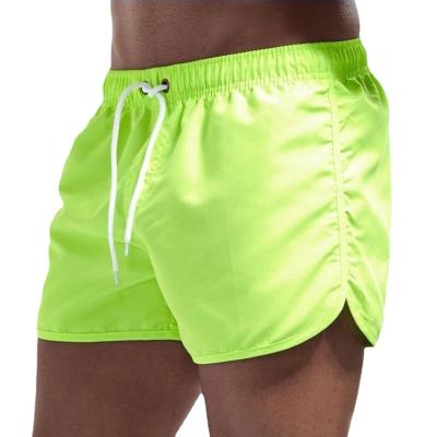 China Anti-wrinkle Custom solid color beach shorts for men sports woven shorts   mens surf board shorts for sale