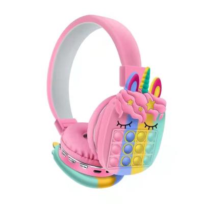 China Unzip Sensory Toy Stress Reliever Stereophone Unicorns Headset Silicone Push Ball Moving Person Earphone for sale