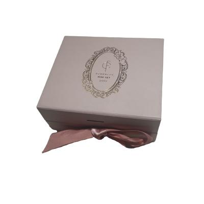 China Logo Handmade Paper Gift Boxes custom made recyclable for nail polish packaging magnetic tape closure box with EVA Insert for sale