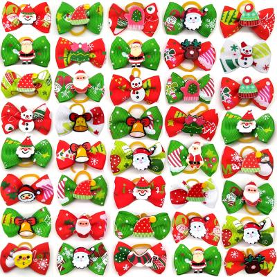 China New Christmas Colorful Stocked Santa Random Dog Hair Bows Of Love Smart Fashion Pet Bow Hair Accessories for sale