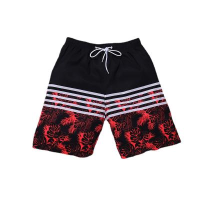 China Fashion QUICK DRY camouflage printing men's swimming trunks summer leisure beach striped loose panel sports sweat shorts for sale