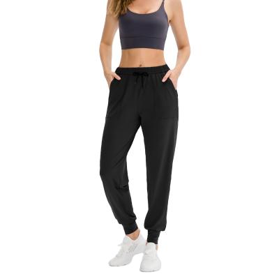 China Fashion Breathable Training Sweatpants Polyester Yoga Pants Girls Fitness Jogger Yoga Pants Loose Quick Dry Elastic Bottom Pants With Pocket for sale