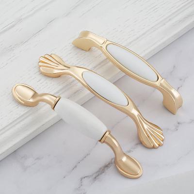 China RKS Modern Luxury Ceramic Furniture Door Handle Drawer Pulls White Ceramic Cabinet Handle Gold Cupboard Handles for sale