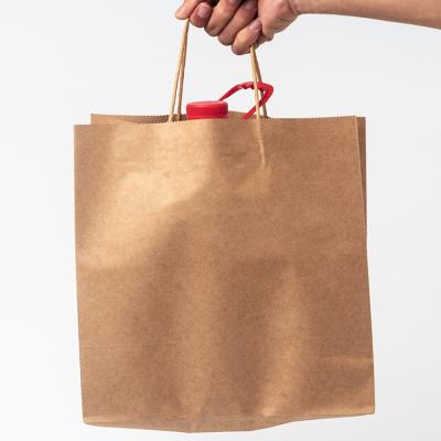 China Craft Paper Shopping Bag Kraft Paper Packaging Bag Moisture Proof Recycled Kraft Paper Bag With Handles for sale