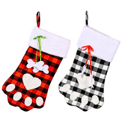 China Free Shipping New Chirstmas Decor Xmas Ornament Plaid Dog Paw Christmas Storing Holiday Kids Gift Bag Creative Gift Bag for sale