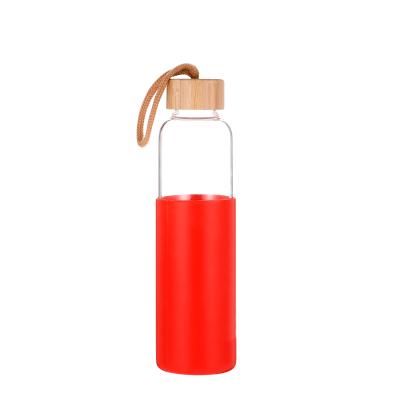 China Viable Hot Sale Mini Luxury Glass Water Bottle Design With Wooden Lid In Bulk for sale