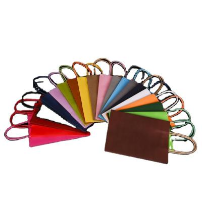 China Kraft Paper Packaging Gift Bag Recyclable Paper Bag With Handle Square Paper Bag for sale