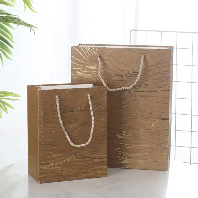 China Recyclable Custom Paper Bags with Logo Stripes Paper Gift Bag Handle Printed Paper Bag for sale