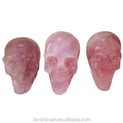 China China Wholesale Pink Crystal Folk Craft Hand-Carved Skull Mounted Stone Carved Skull for sale